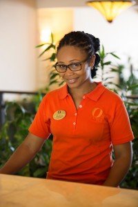 A happy front desk clerk at Ocean Two in Barbados