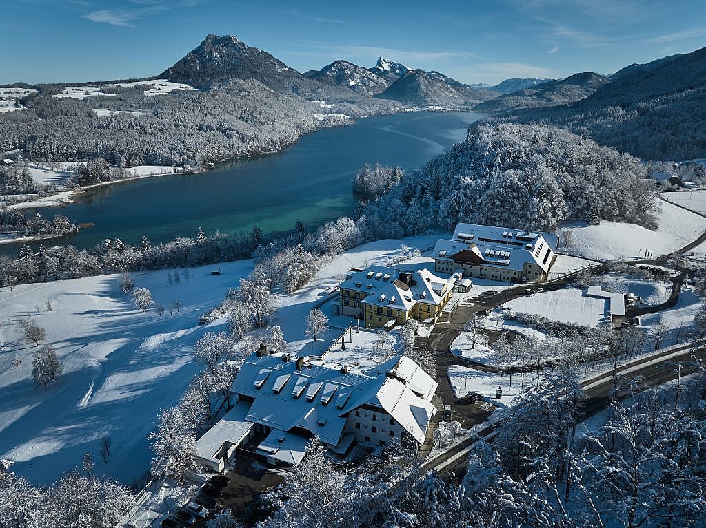 A Winter view of the hotel and Lake Fuschl