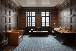 Heritage lounge at Hyatt Centric with wood-paneled walls and leather seating.