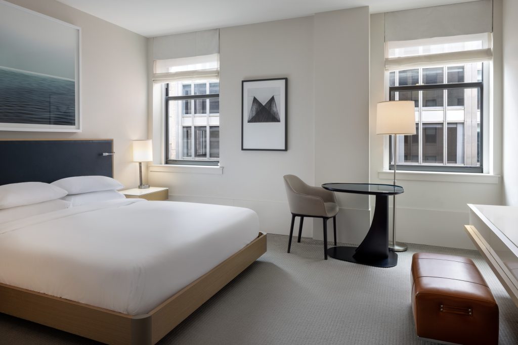 King guest room at Hyatt Centric The Loop with city-facing windows and clean design.