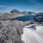 Seasonal hotel photography with one lakefront angle captured in summer and winter