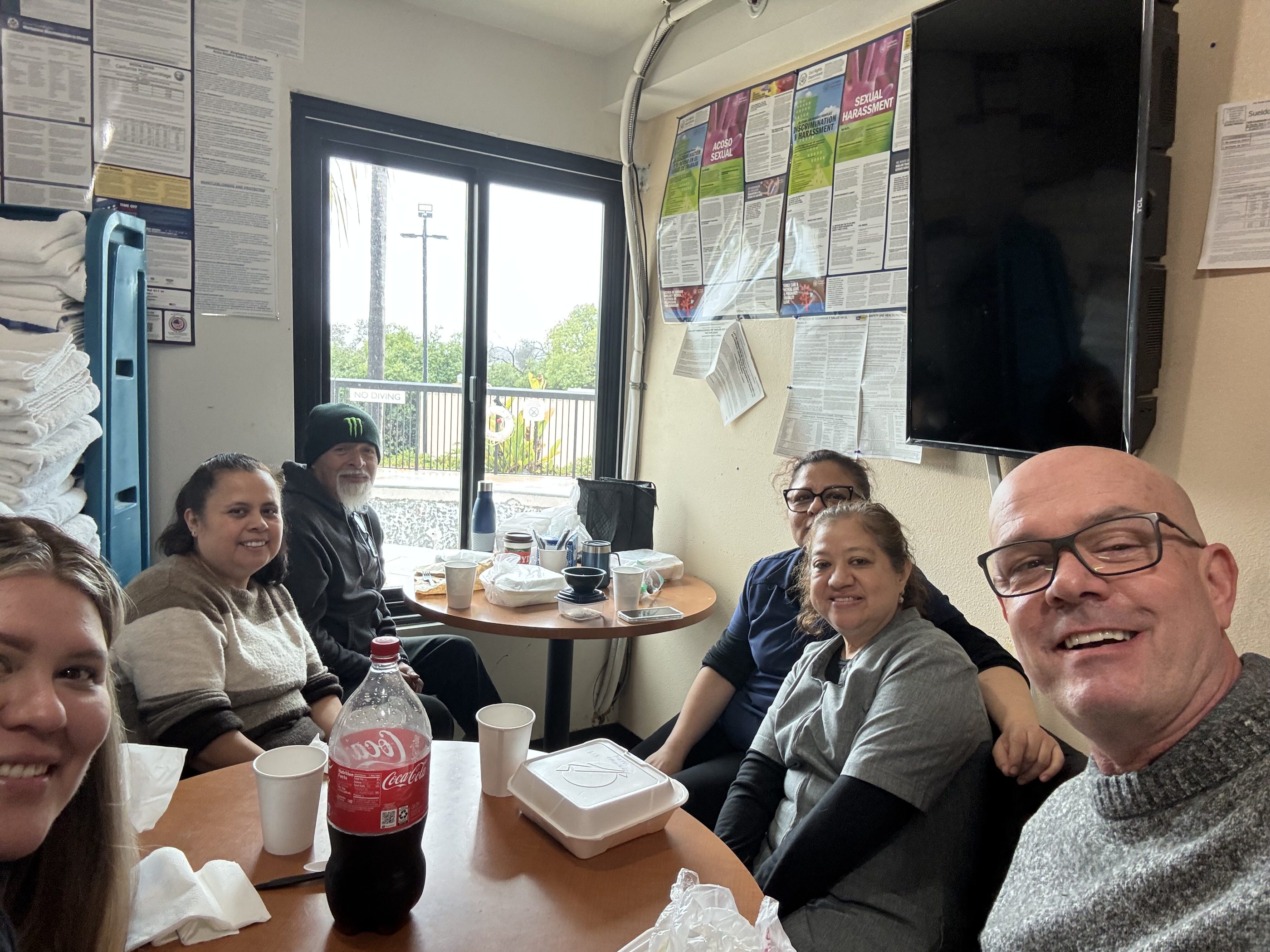 Photographer and hotel staff sharing lunch together during hotel renovation photography at Fairfield Inn Mission Viejo