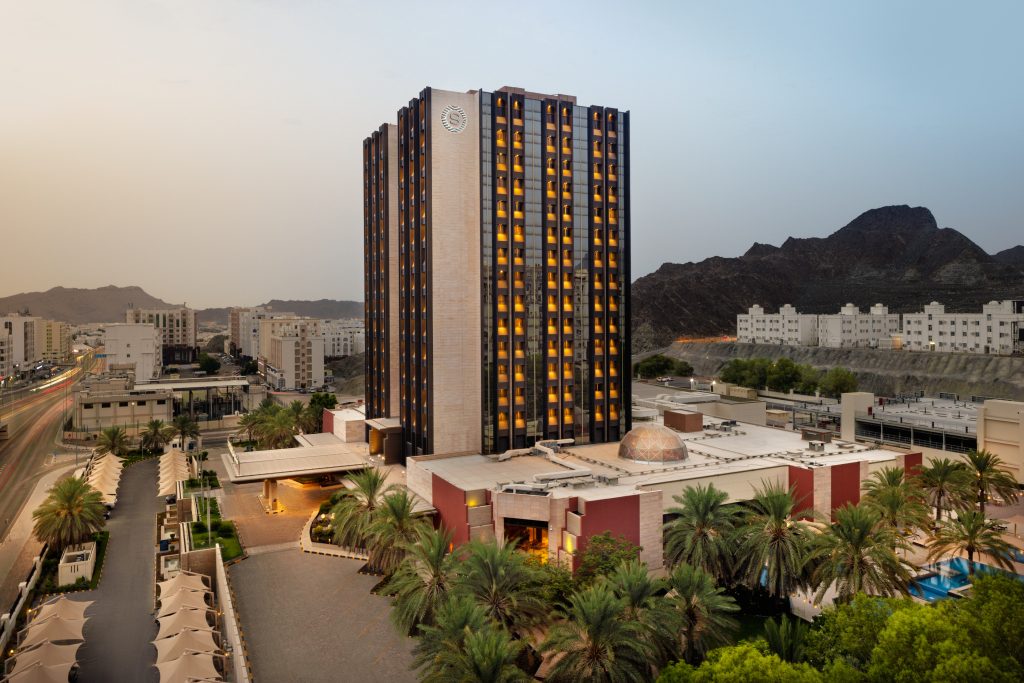 sheraton muscat hotel photography exterior at dusk