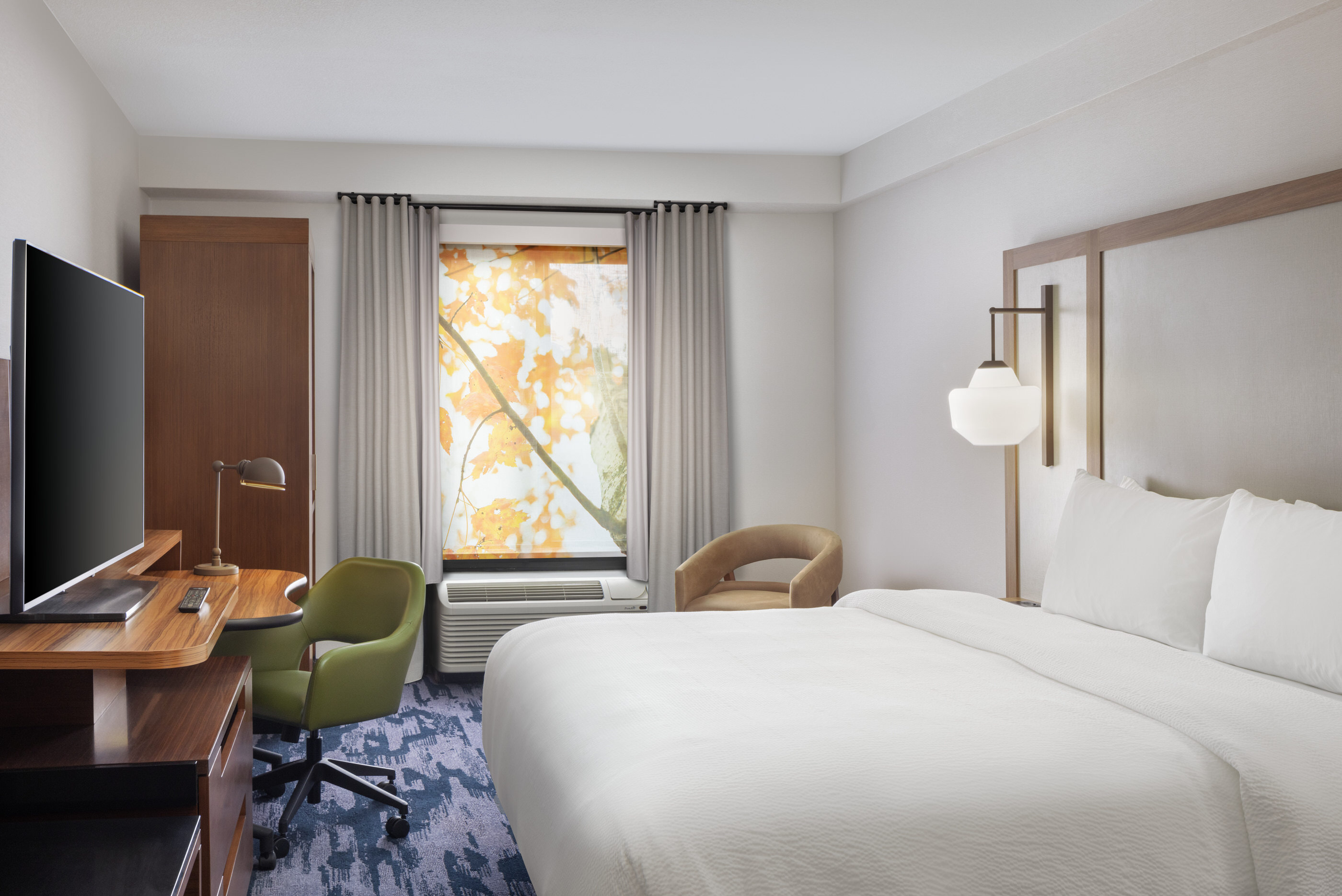 King guest room at Fairfield Inn Mission Viejo with large window and autumn courtyard view