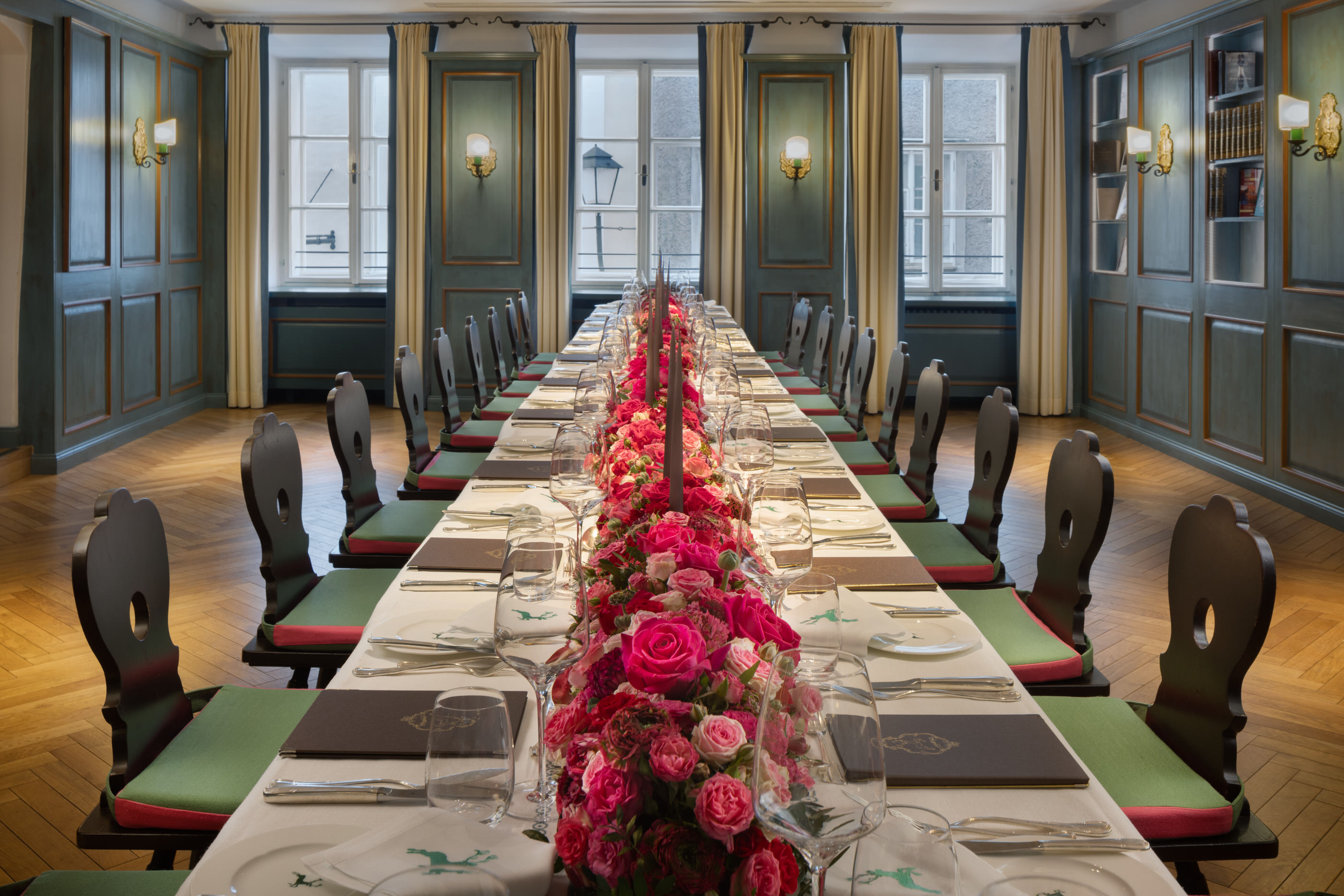 Long table with pink rose centerpiece in Bibliothek Room, Salzburg