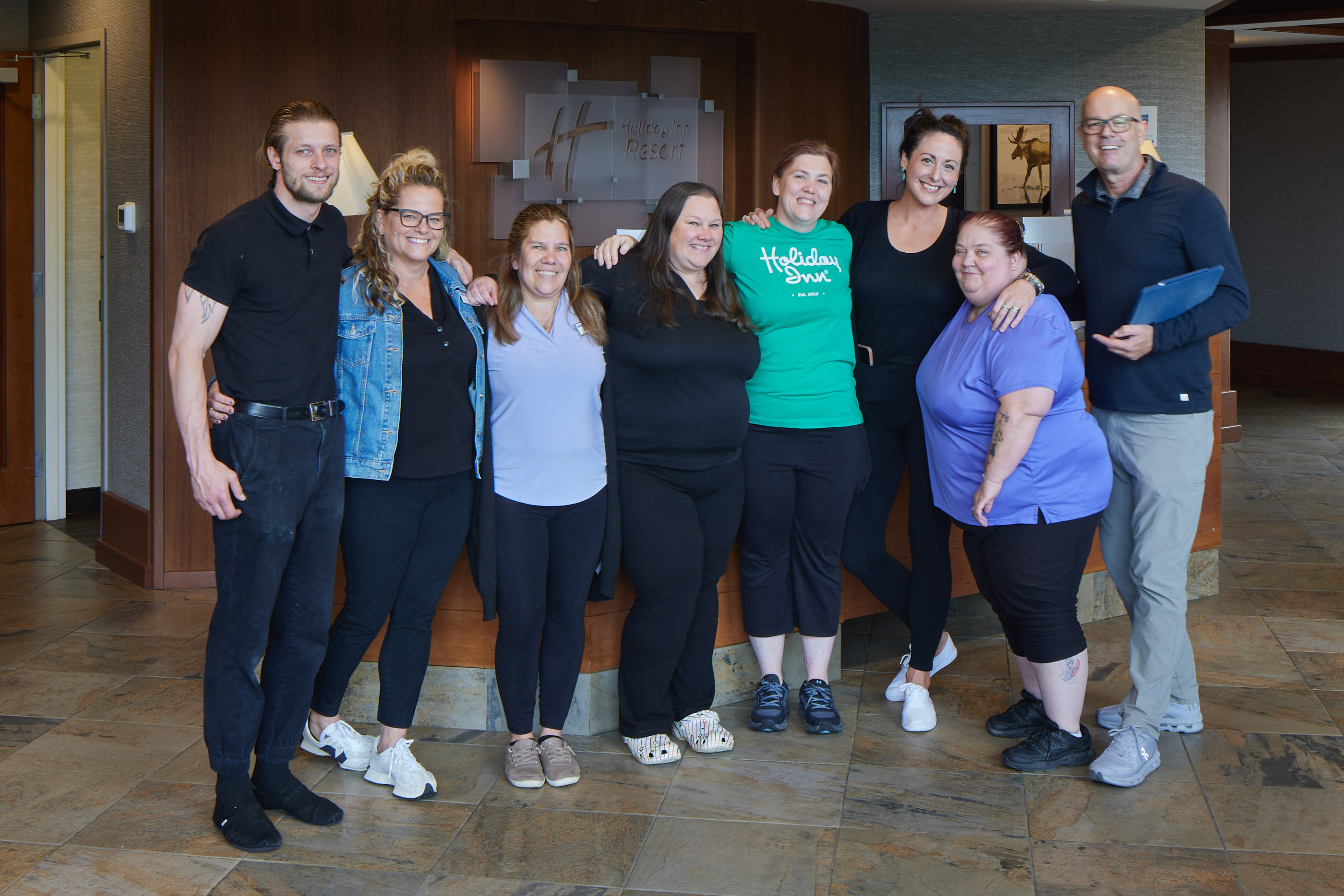 Steven Graffham with hotel staff team during pre-shoot prep, demonstrating the importance of having the right people available for a successful photo shoot.