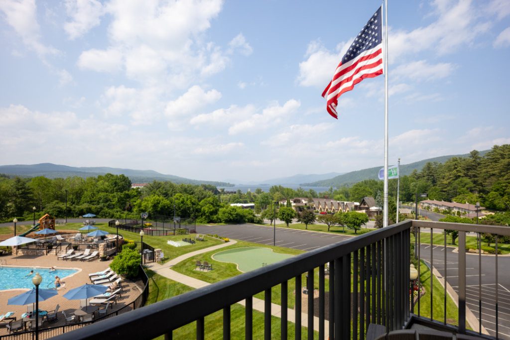 Scenic balcony view of Adirondack Mountains from Holiday Inn Lake George resortBalcony view from Holiday Inn Lake George resort showcasing panoramic Adirondack Mountains and surrounding Lake George scenery.
