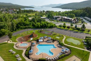 Aerial view of Holiday Inn Lake George pool with Adirondack Mountains and Lake George in the background