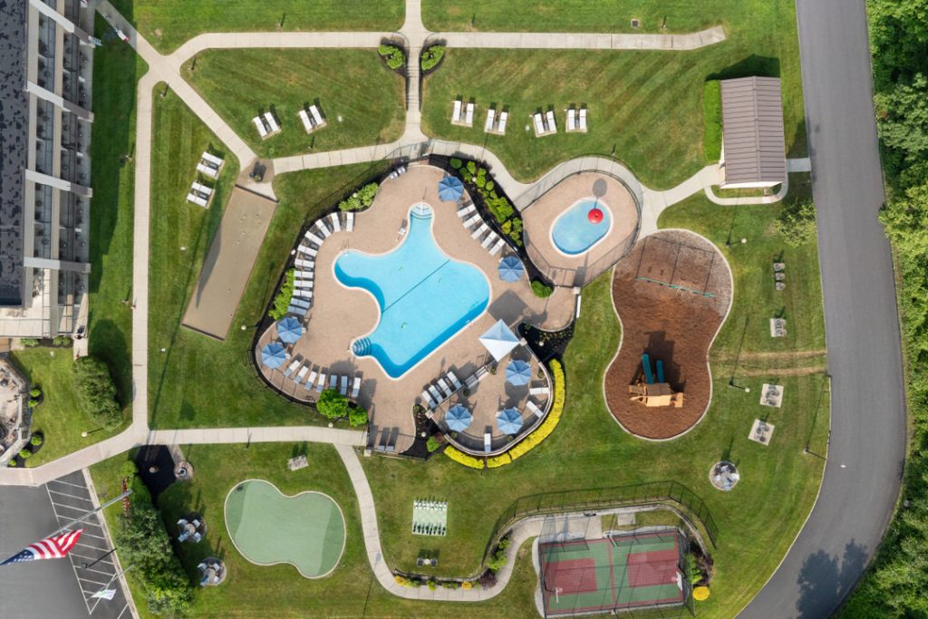 verhead drone view of Holiday Inn Lake George pool and activity areas