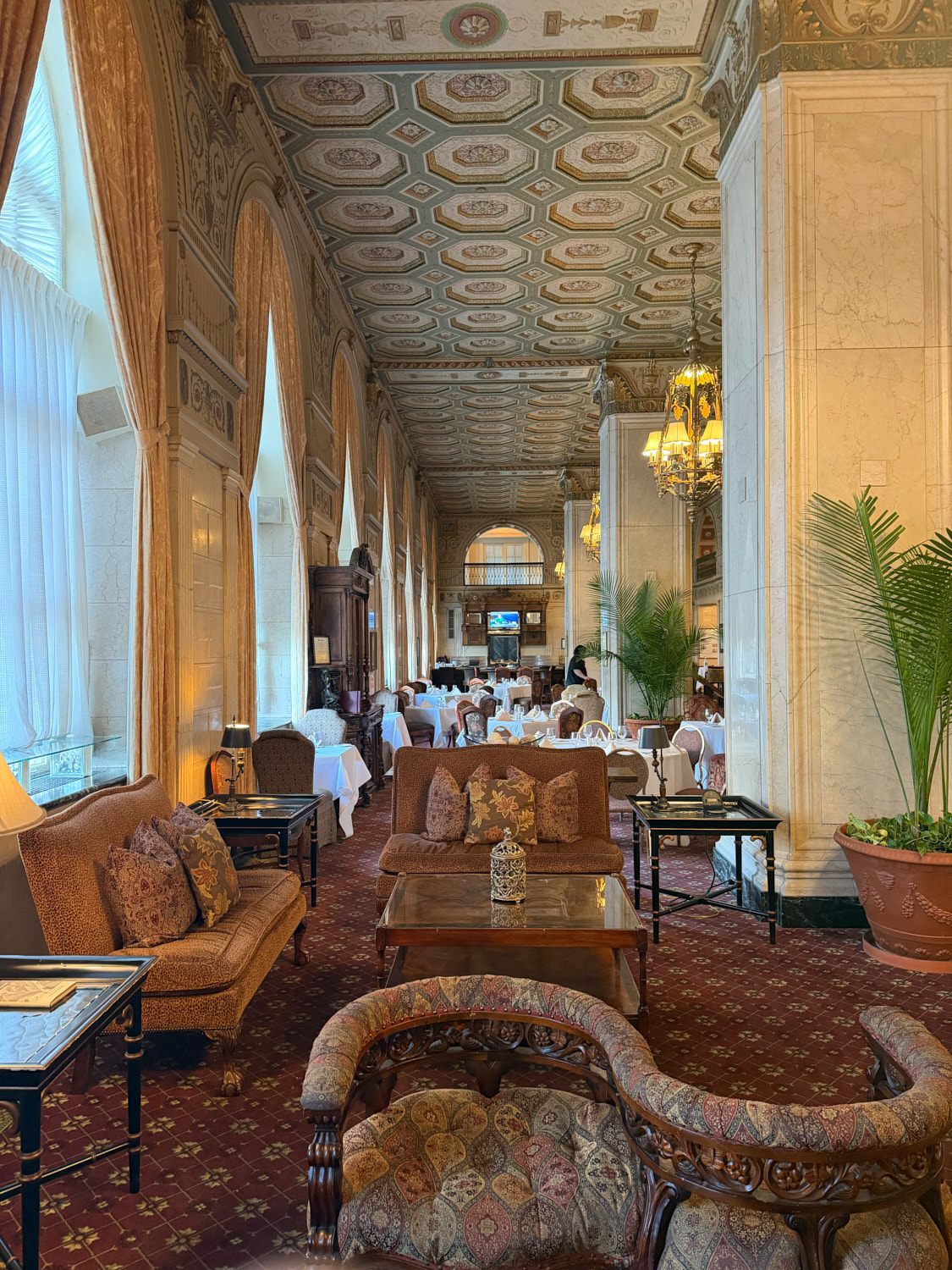 Ornate dining and seating room inside The Brown Hotel in Louisville