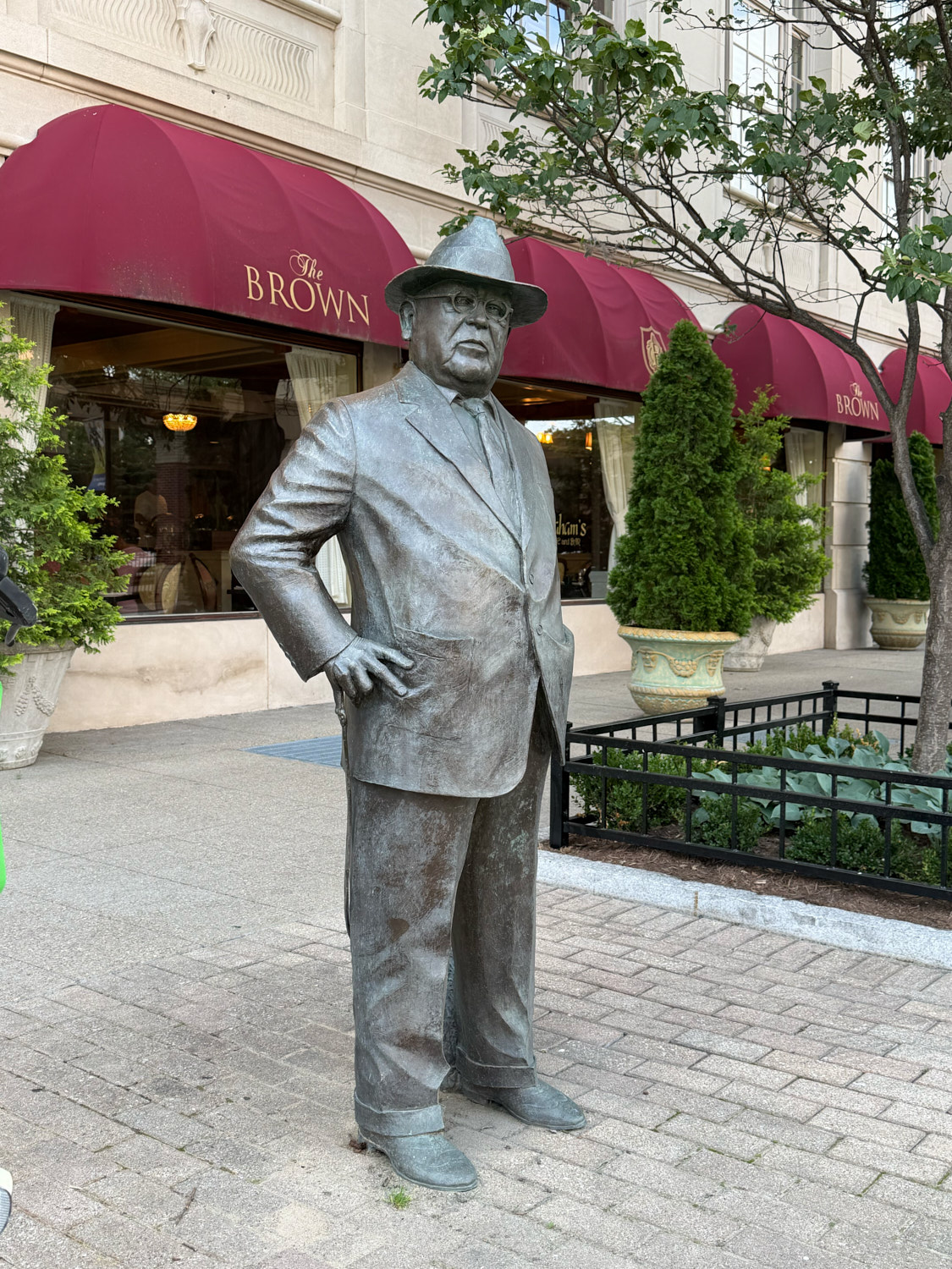 Bronze statue outside The Brown Hotel entrance