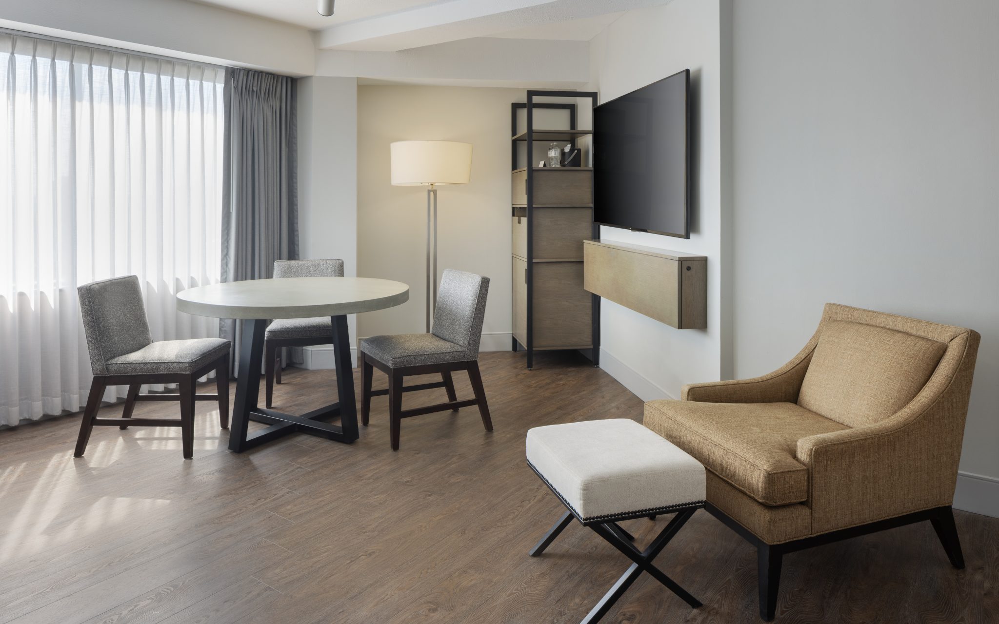 Seating and dining area in a Hyatt Regency Louisville suite