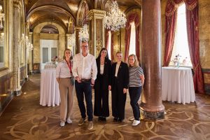 Five members of the Hotel Imperial Vienna photography project team standing together in a grand salon
